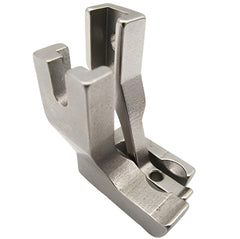 Metal sewing machine presser foot on a white background Metal sewing machine presser foot on a white background