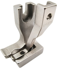 Metal sewing machine foot on a white background Metal sewing machine foot on a white background