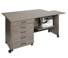 Gray office desk with drawers and a sewing machine on a white background Gray office desk with drawers and a sewing machine on a white background