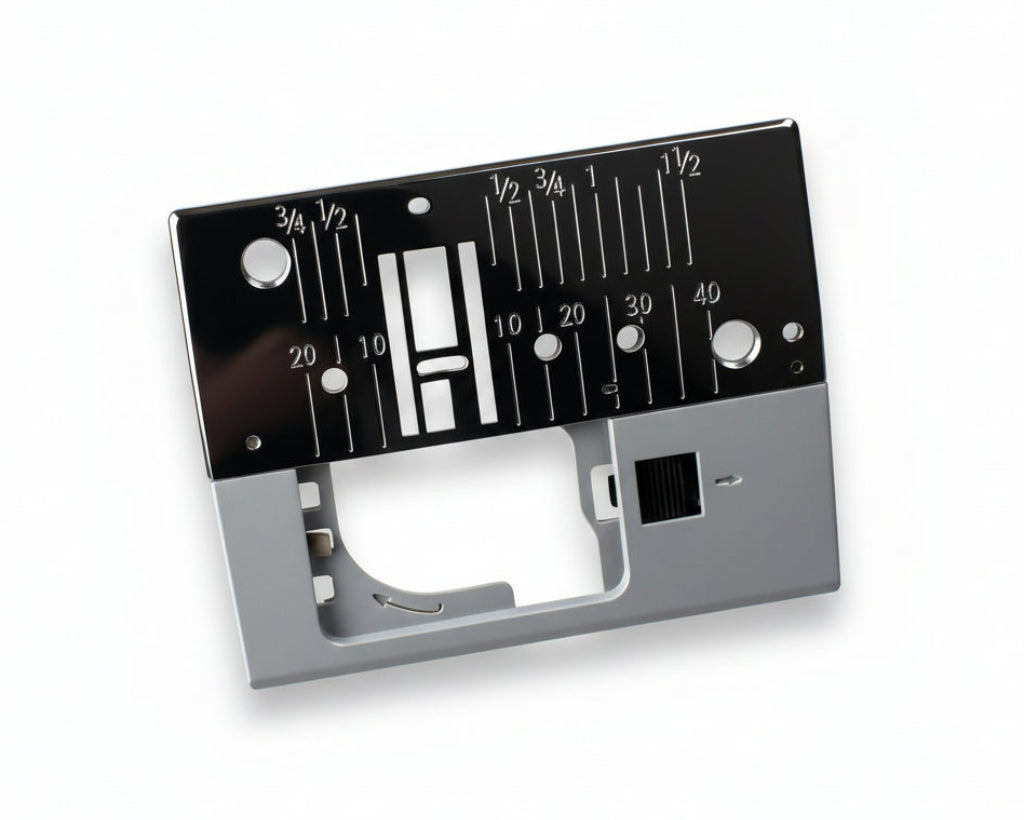 A metal needle plate for a Janome sewing machine, displaying measurement markings and a guide for needle placement.