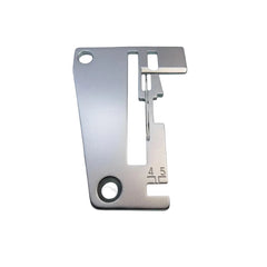 Metal sewing machine needle plate on a blue background