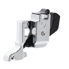 A close-up of a sewing machine press foot with a polished silver metal body and a black plastic lever, shown on a solid white background.