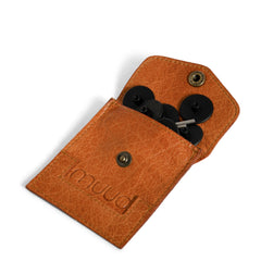 Brown leather pouch with black buttons on a white background