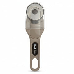Measuring tool with a clear cylindrical component and metallic handle on a white background