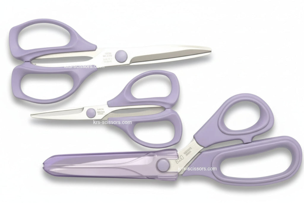Set of purple scissors with black handles on a white background