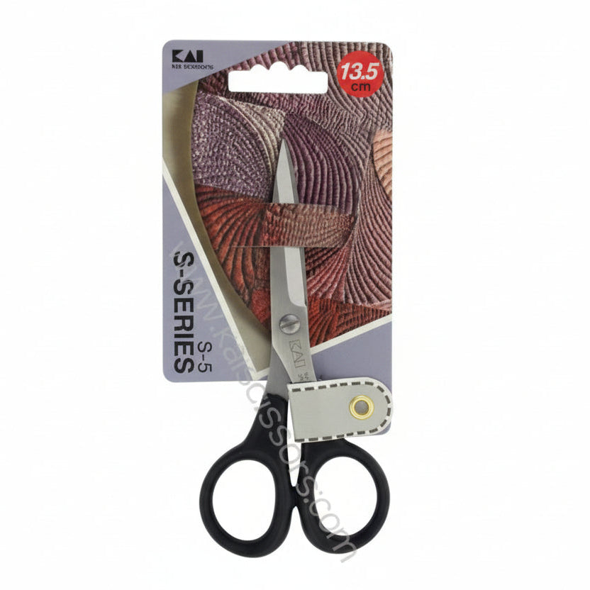 Pair of scissors with a decorative sheath on a KAI branded packaging