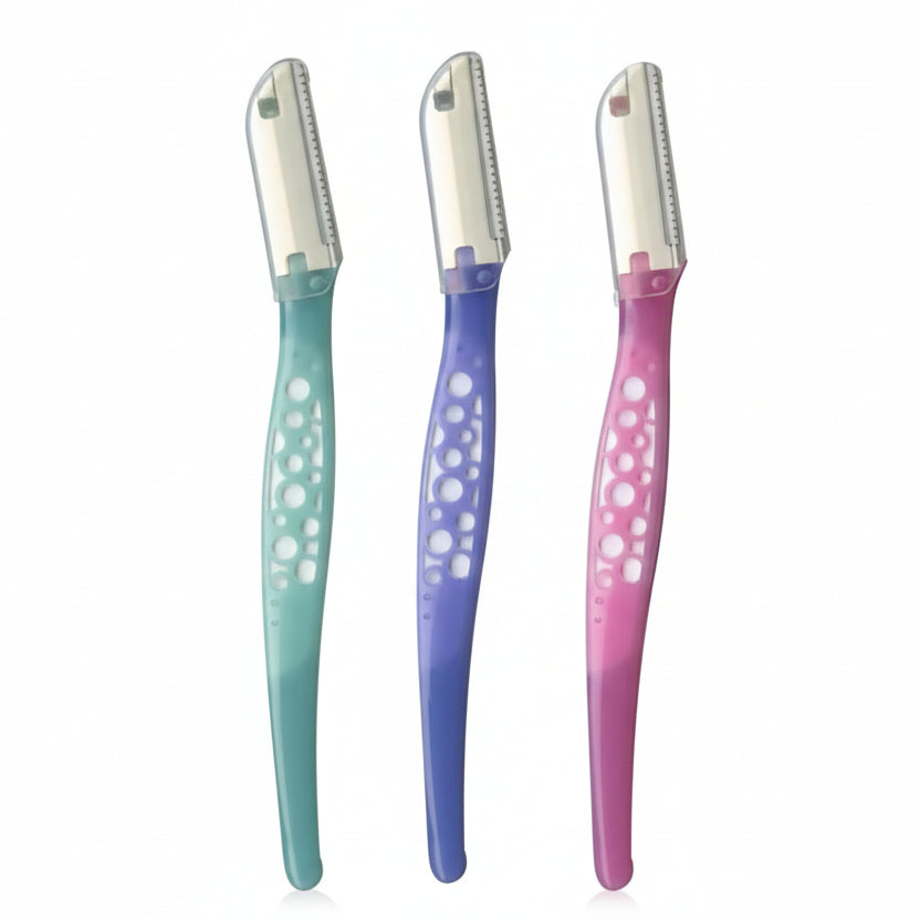 Three eyebrow razors with gradient blue and pink handles on a white background