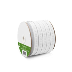 Spool of white ribbon with a green label on a white background