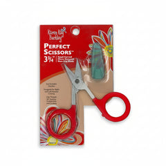 Red-handled scissors in packaging with Karen Kay Buckley branding