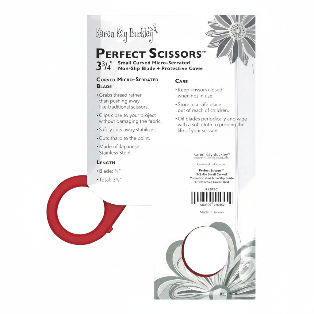 Red scissors with packaging featuring text and floral designs on a white background