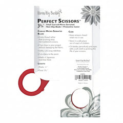 Red scissors with packaging featuring text and floral designs on a white background