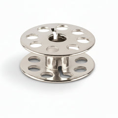 Two metal spools on a white background