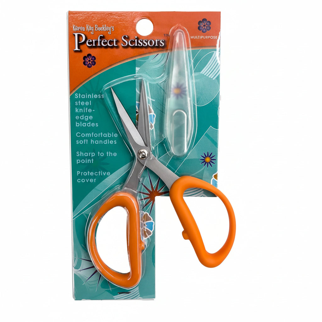 Scissors with orange handles in a colorful packaging