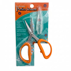 Scissors with orange handles in a colorful packaging