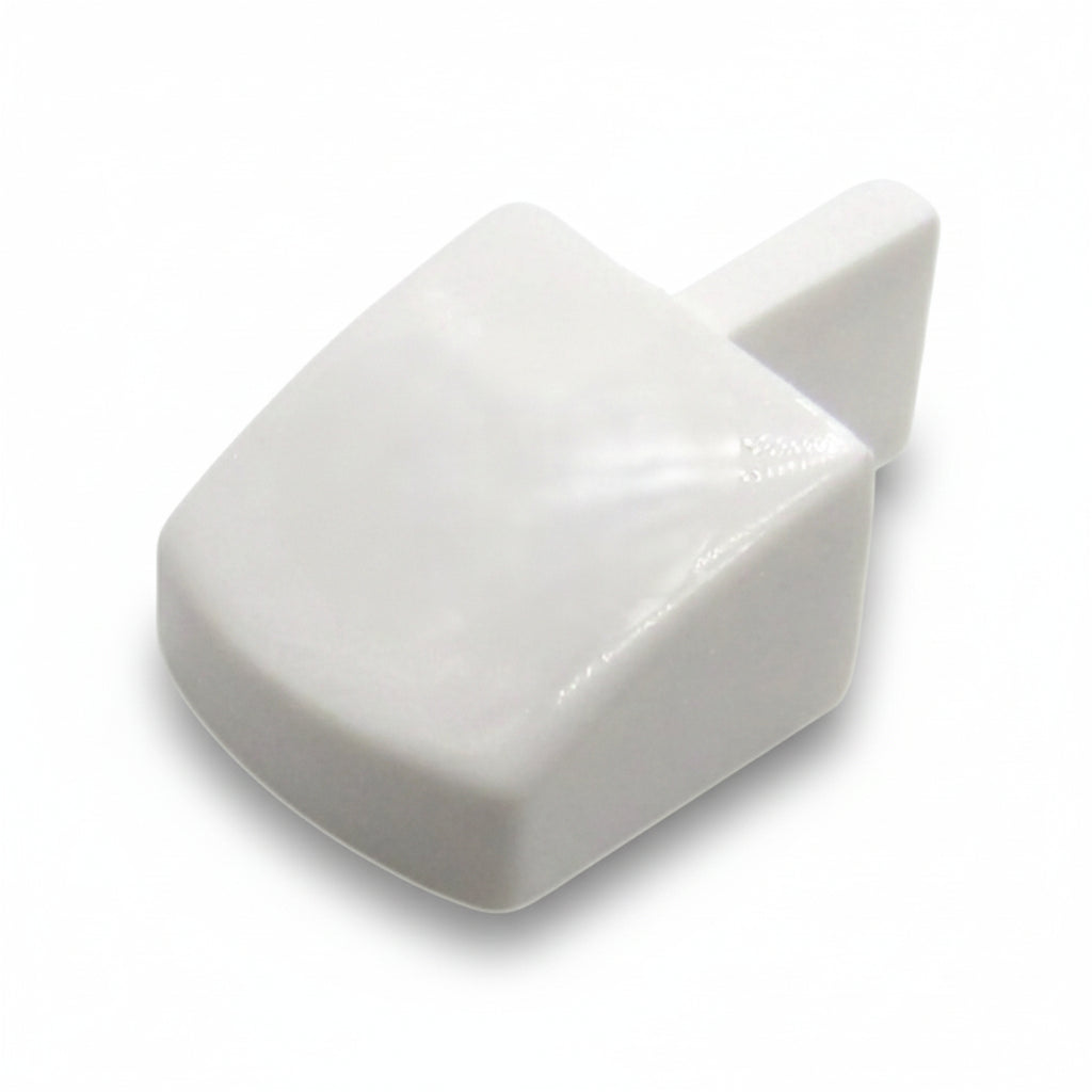 White plastic wedge-shaped object on a white background
