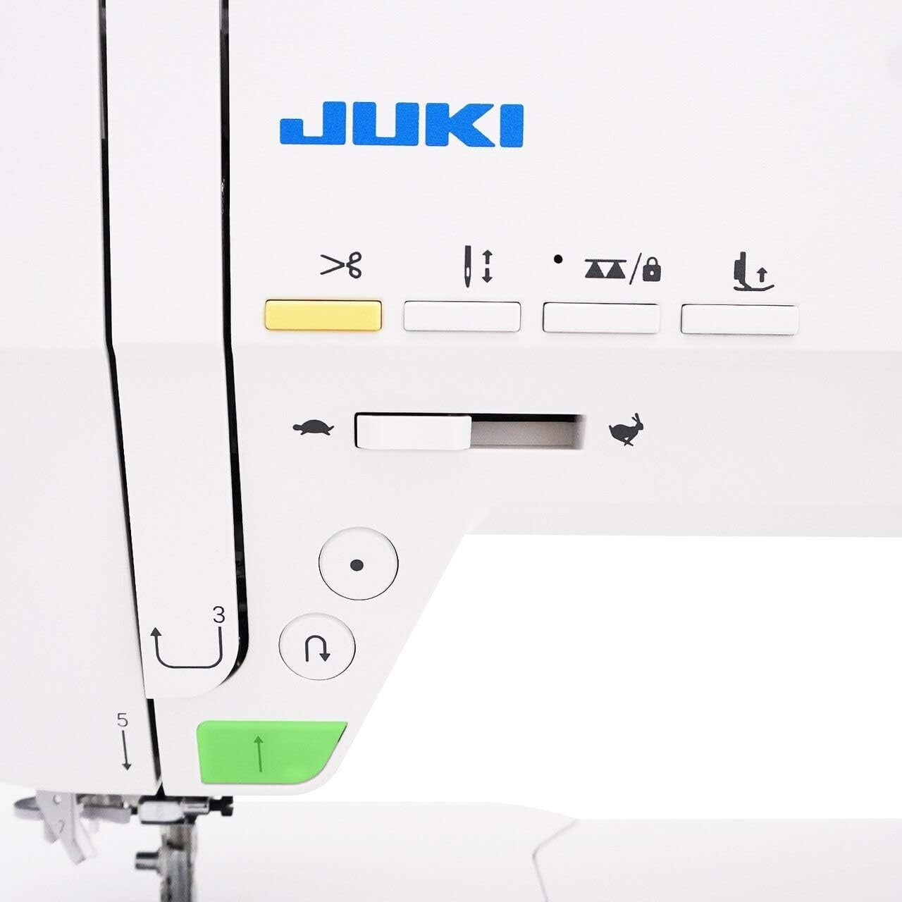 Close-up of a Juki sewing machine with control panel and needle