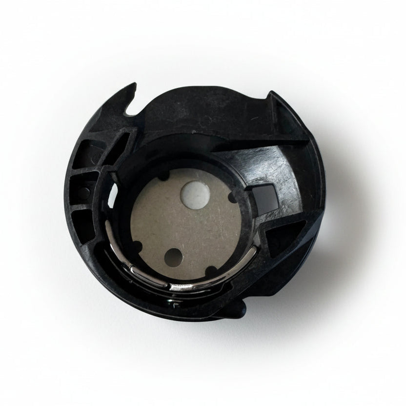 Black mechanical component on a light gray background