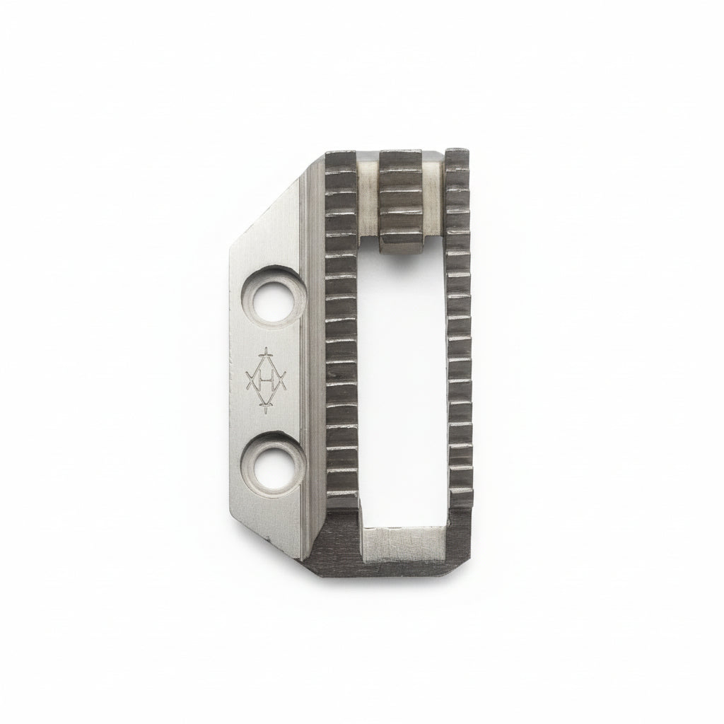 Metallic tool blade with engraved design on a gray background
