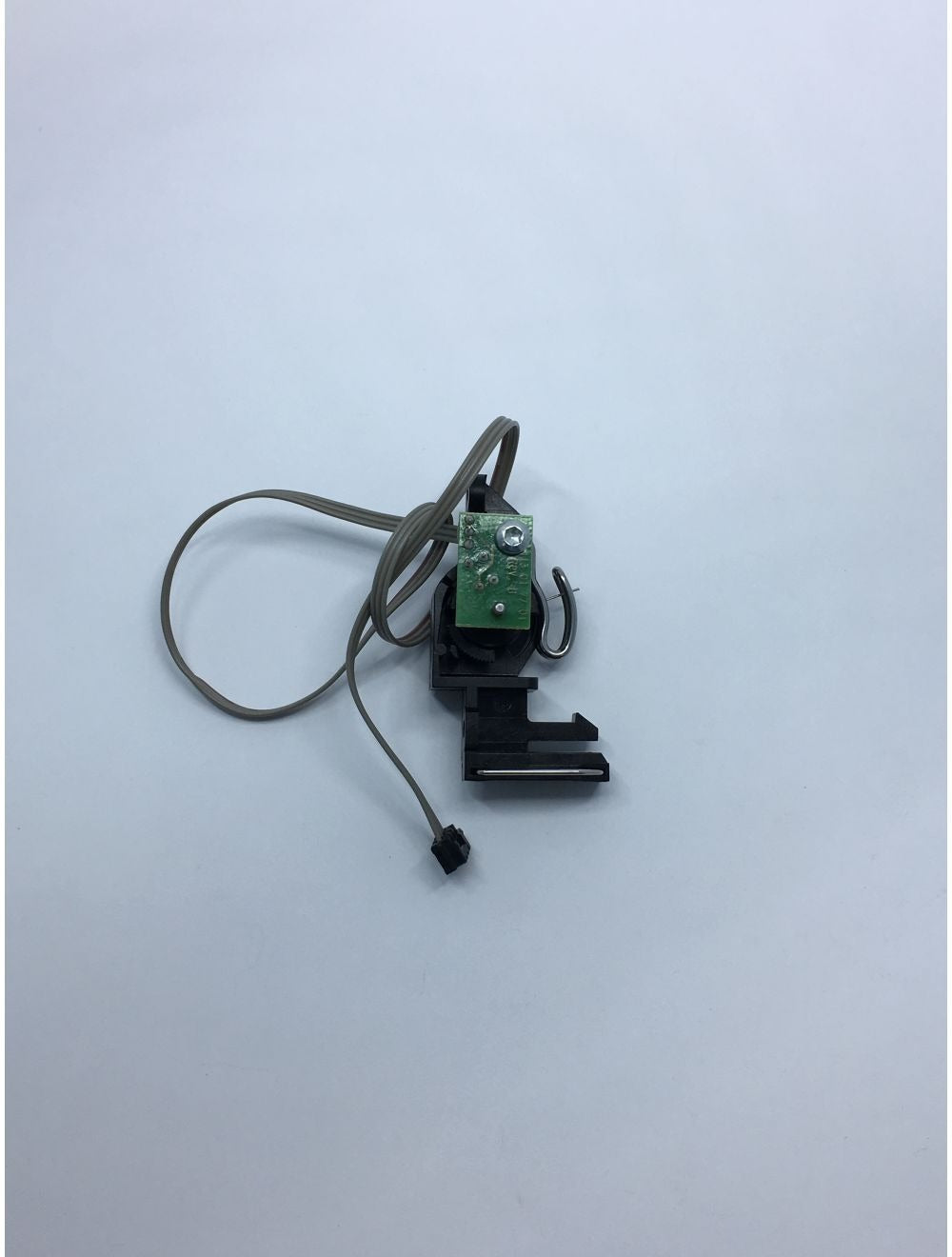 Electrical component with green connector on a white background
