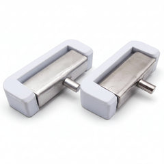 Two metallic door handles with white plastic covers on a white background