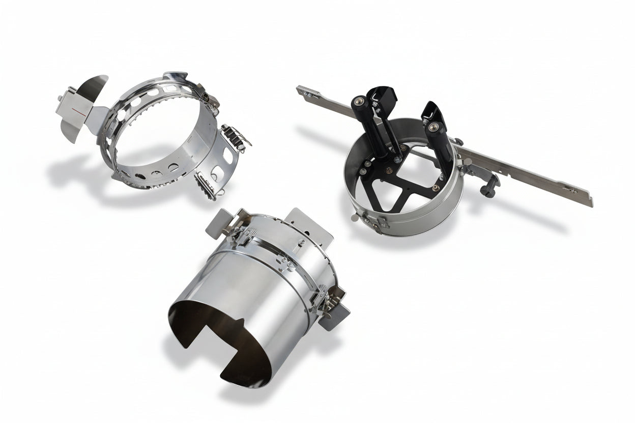 Three metal lampshades on a white background