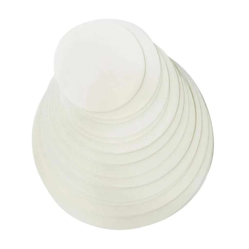 White spherical object with concentric circular patterns on a white background