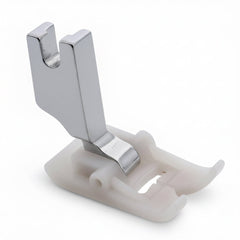 Metallic sewing machine presser foot on a white background