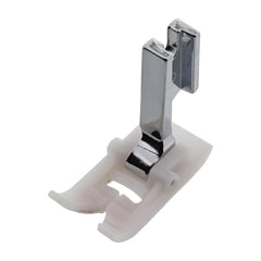 Metallic sewing machine presser foot on a white background