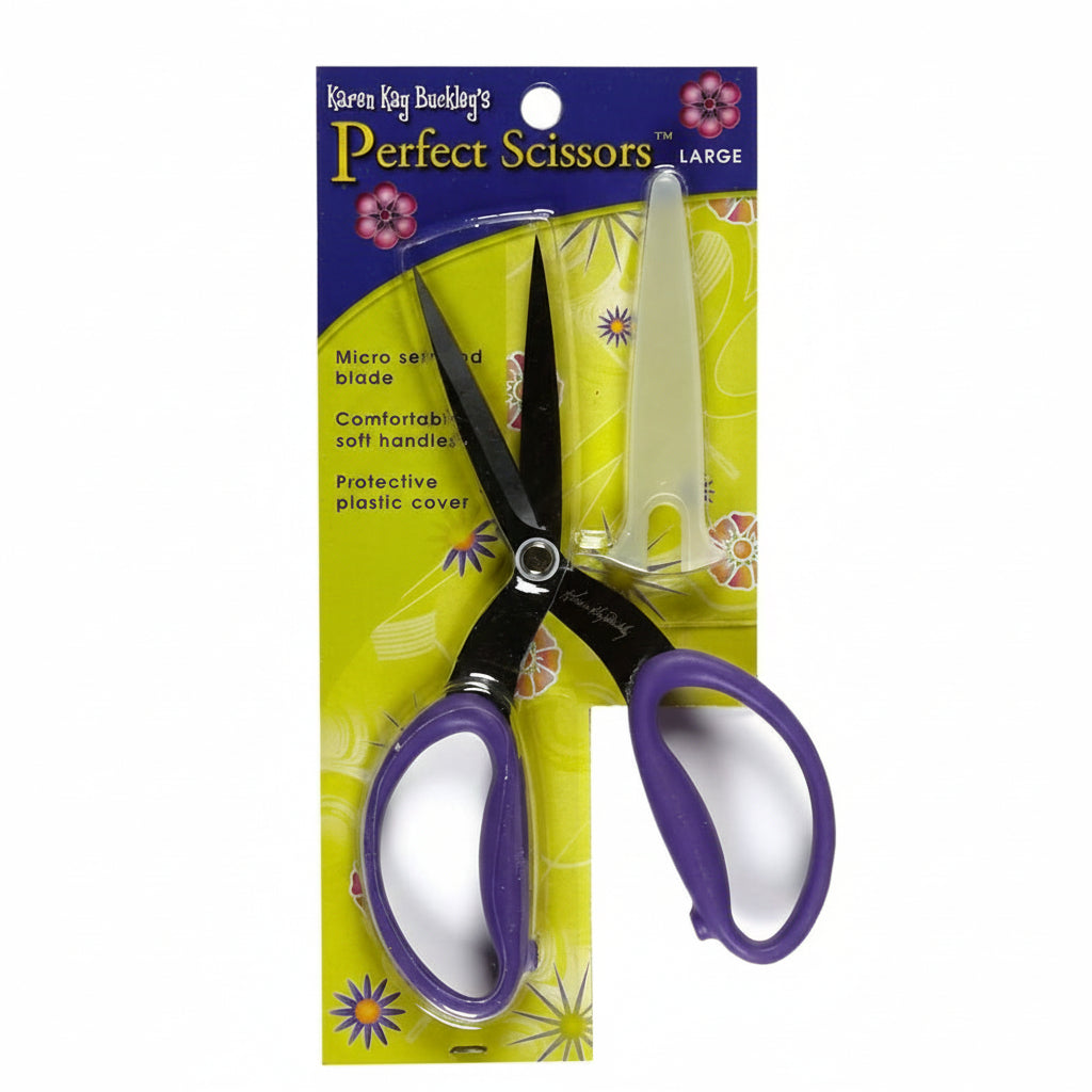 Large scissors with purple handles in packaging on a white background