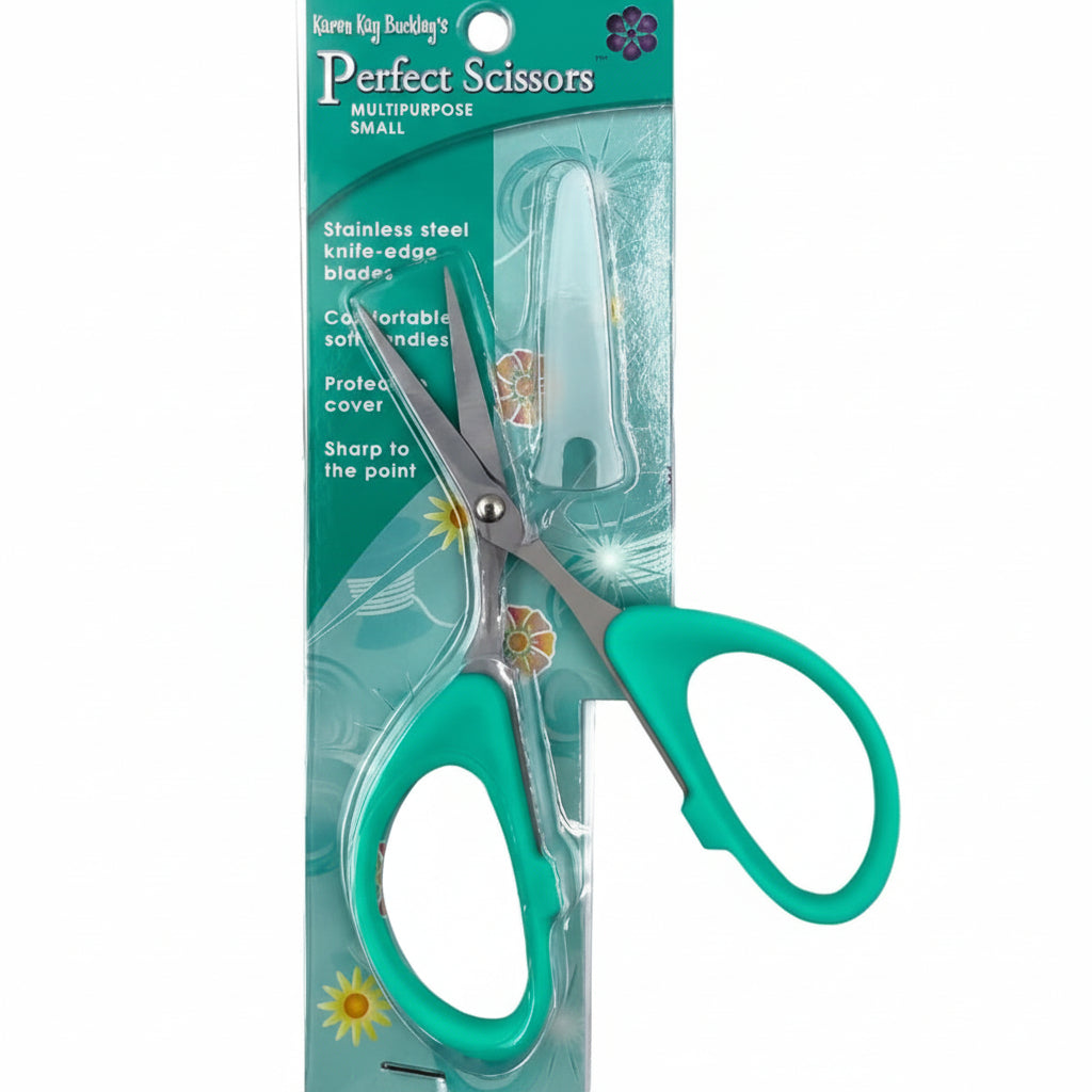 Green scissors with floral design on packaging