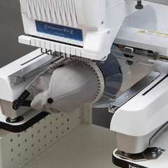 Embroidery machine with a cap being embroidered, branded 'Entrepreneur Pro X'.