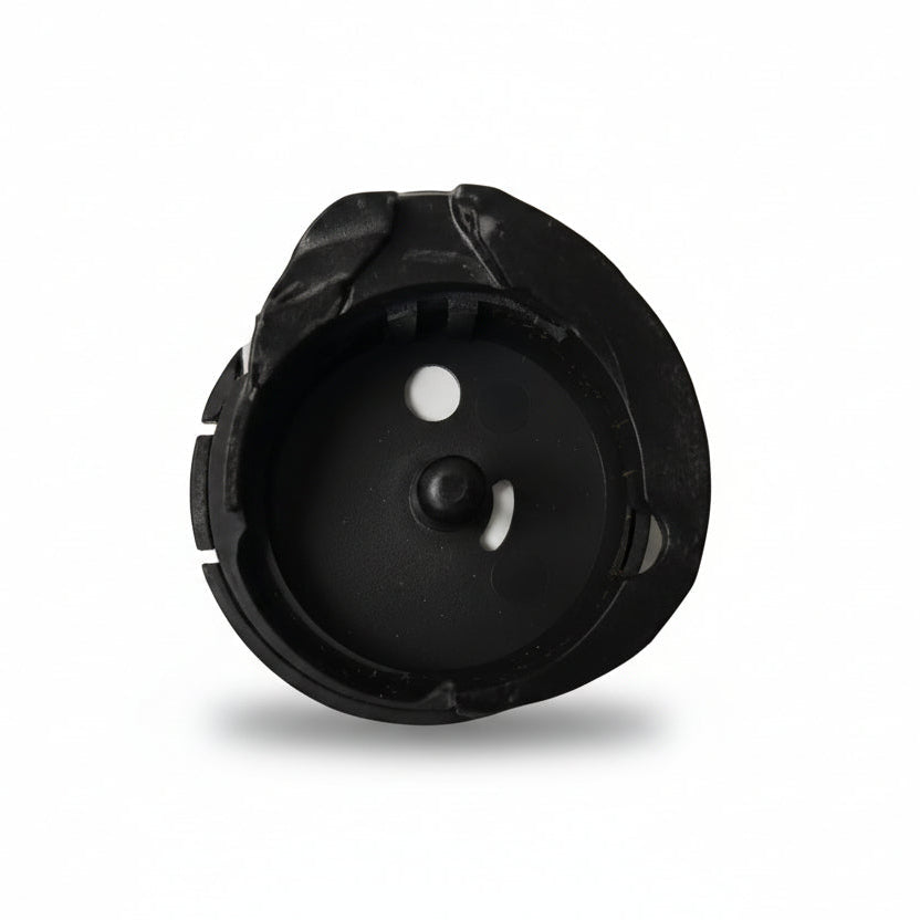 Black plastic component on a white background