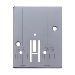 A gray Janome needle plate for sewing machines, displaying measurement markings and holes for needle placement.