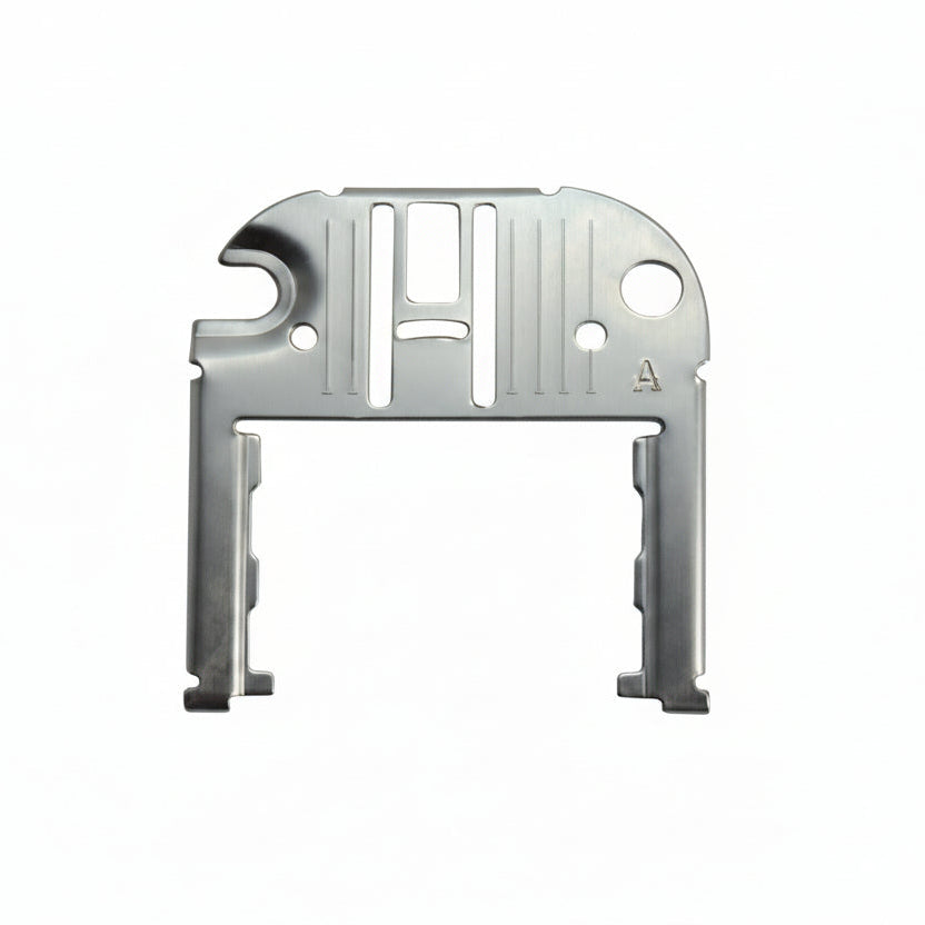 Metallic object with cut-out design on a white background