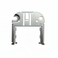 Metallic object with cut-out design on a white background